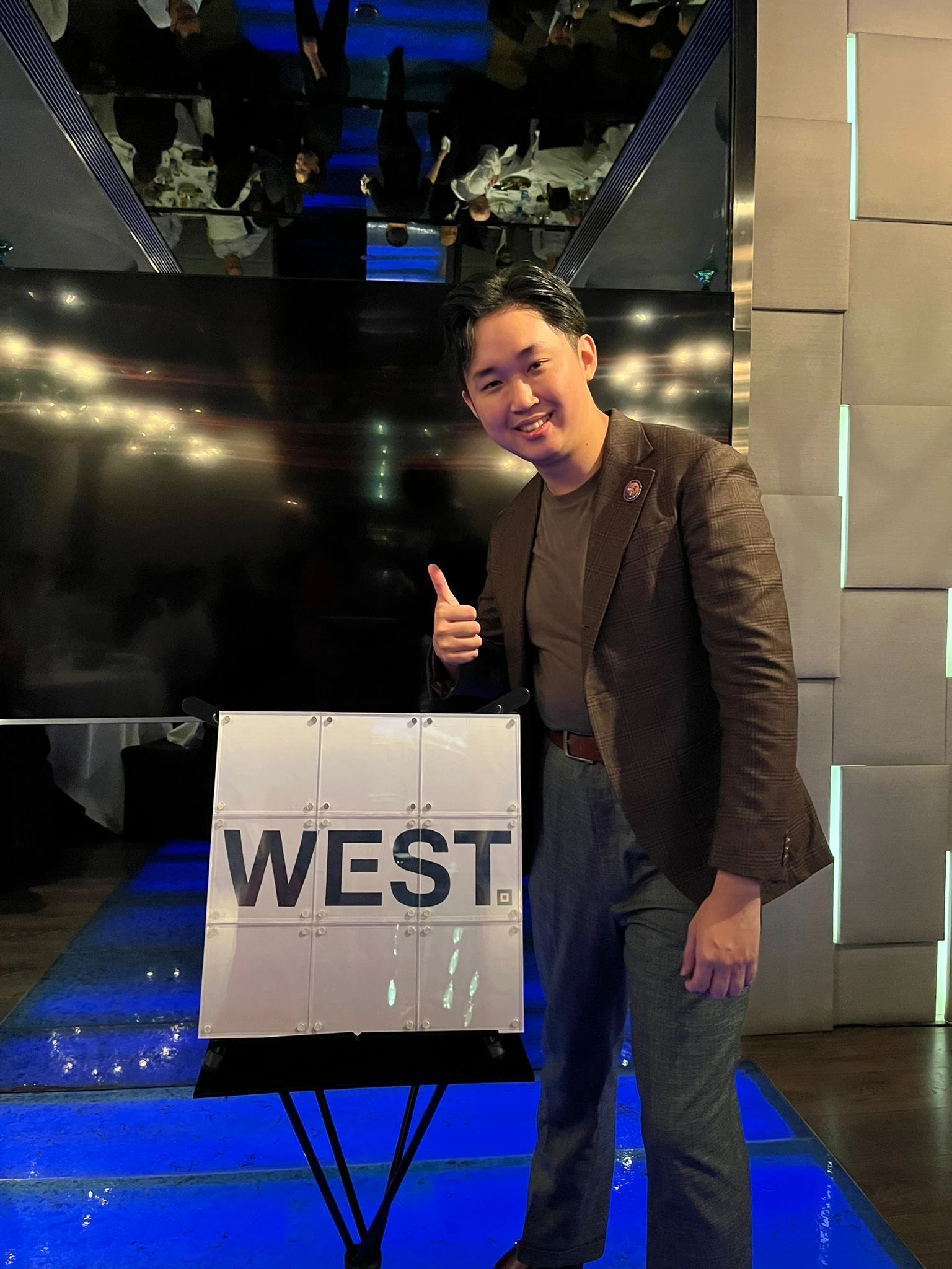 Magic revealing a company logo on stage