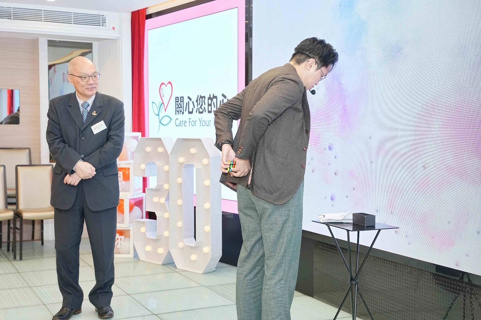 Corporate magician engaging audience at a gala dinner