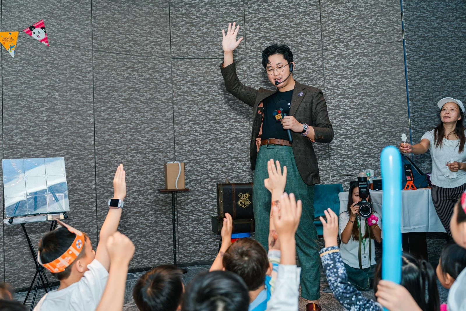 Kids raising hands in excitement