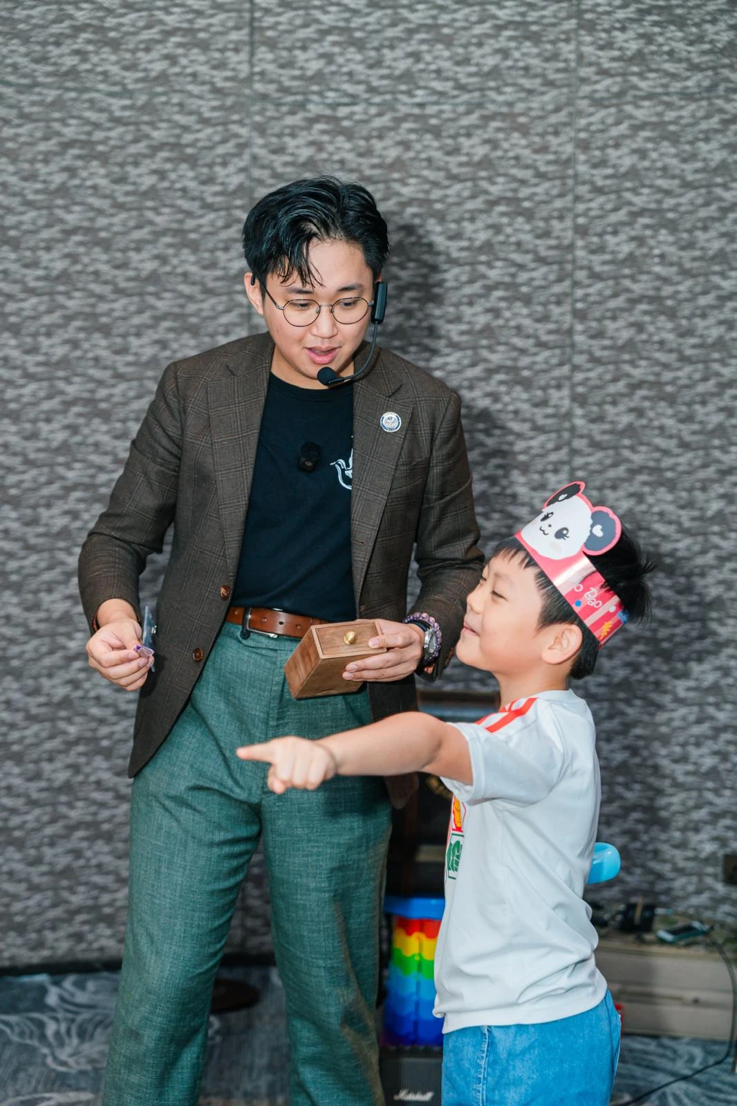 Kids pointing and interacting with magician