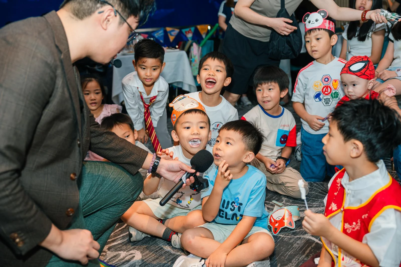 Magician interacting with a crowd of kids